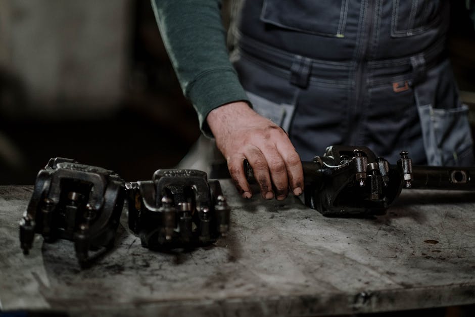 Mechanic holding auto glass repair tools